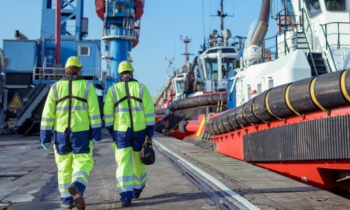 Marine Engineering services in Immingham- showing a photo of workers walking towards the ship